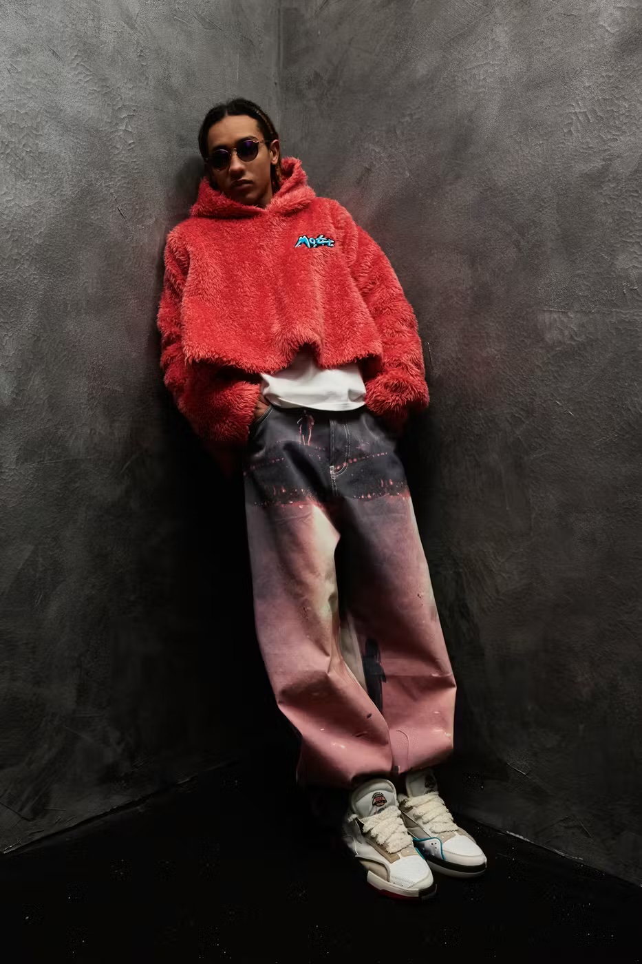 Members of the Rage — sunset-print jeans with red fleece and MOTR logo